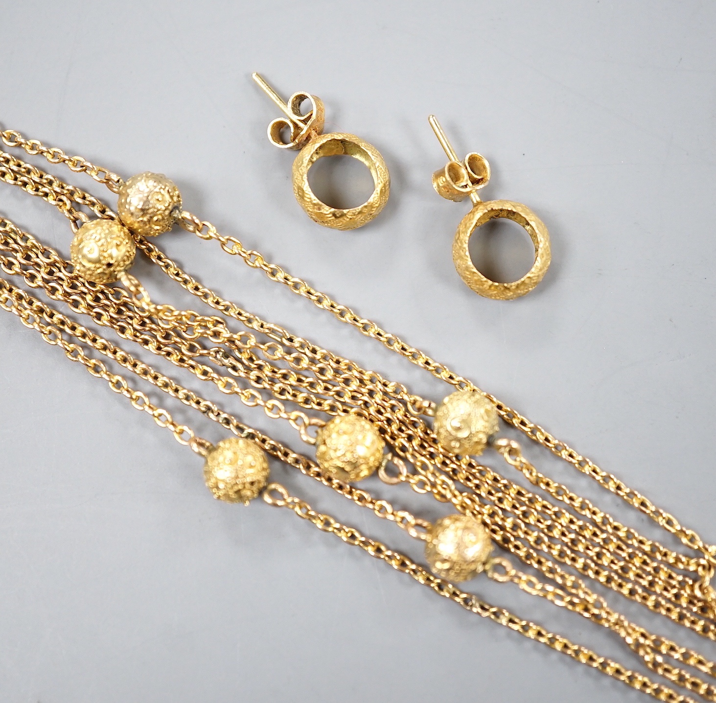 A 9ct guard chain with spherical spacers and a pair of 9k earrings, 11.7 grams.